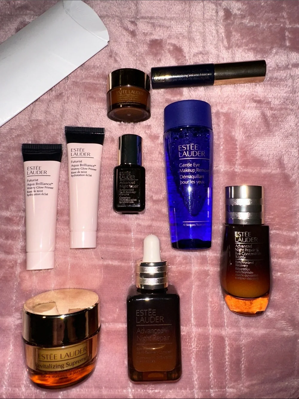 Estee Lauder Skincare Assortment with Blue, Pink, Gold and Brown Accents